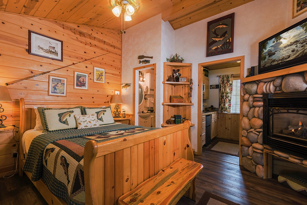 Fireside Lodge hotel in South Lake tahoe. Cozy cabin decor with a fireplace in the room