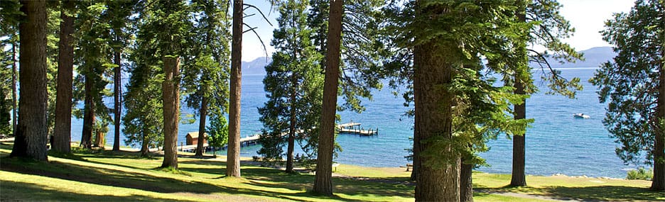 Stretch of grass at Sugar Pine Point State Park, leading to the pier and boat house on Lake Tahoe