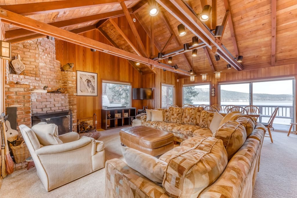 Rustic cabin living room with lake views